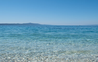 The sea is calm, space. Clear water, rocky shore in Croatia 