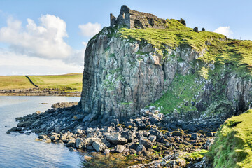 Basalt promontory with ruins of the Duntulm castle, on the north coast of Trotternish, in the Isle of Skye in Scotland.