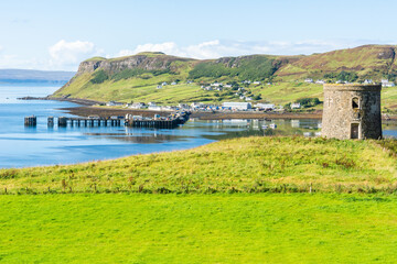Uig harbour, pier and tower in the Isle of Skye in Scotland. - obrazy, fototapety, plakaty
