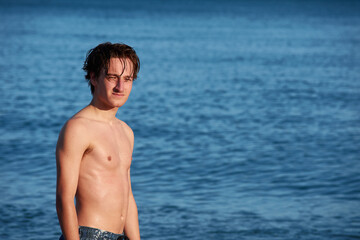 A portrait of a young fit caucasian male in the sea