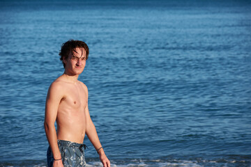 A portrait of a young fit caucasian male in the sea