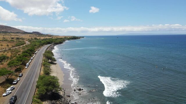 Aerial view of the west coast of Maui. Blue ocean and dry land with mountain on the background. Area of Olowalu, Hawaii 