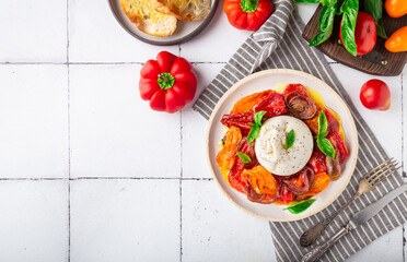 Burrata cheese with baked tomatoes, pepper, red onion and fresh basil