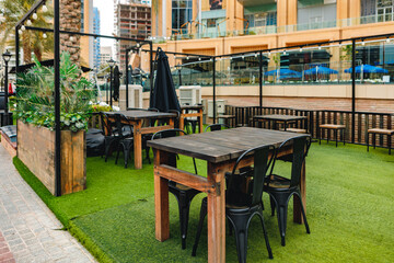 Empty table and chairs of street cafe