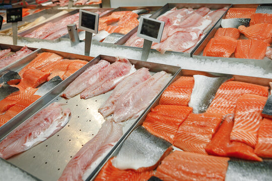 Fresh Fish Assorted On Ice Counter In Supermarket