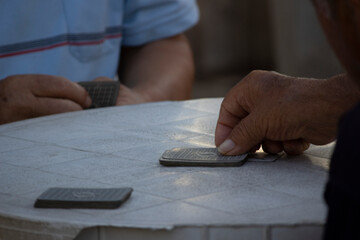 close up of a person playing cards
