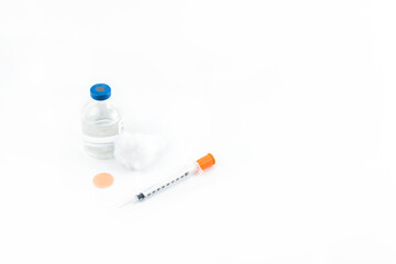 Close-up of the vial and the syringe to place the vaccine on a white background. isolated