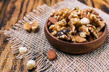 nuts in a wooden bowl on the table