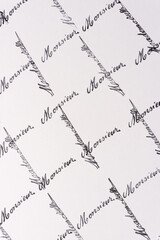 rubber stamp background with the french words monsieur and mademoiselle arranged in a grid pattern