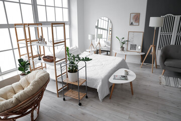 Interior of stylish room with comfortable bed