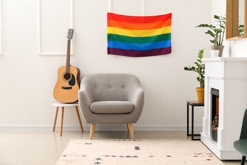 Interior of stylish living room with flag of LGBT