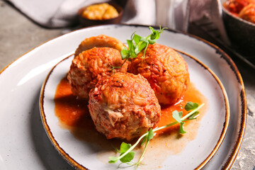 Plate with delicious meatballs on table