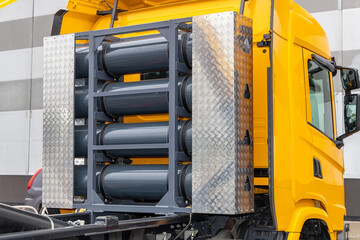 Compressed natural gas cylinders behind the truck cab. Truck with a methane engine. CNG as a fuel....