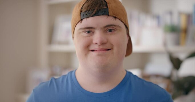 smiling boy with down syndrome happy special needs teenager with disability at home testimonial concept 4k
