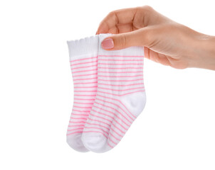 Woman holding baby socks on white background
