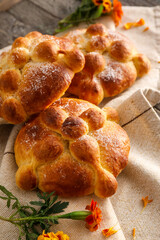 Bread of the dead and marigold flowers on table. Celebration of Mexico's Day of the Dead (El Dia de Muertos)