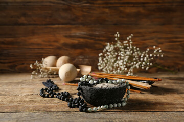 Composition with Tibetan prayer beads on wooden background