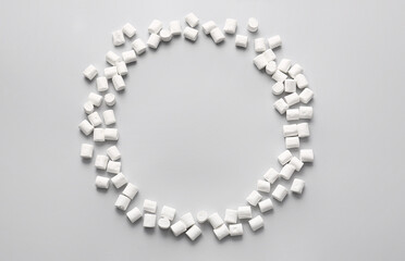 Frame made of tasty marshmallows on light background