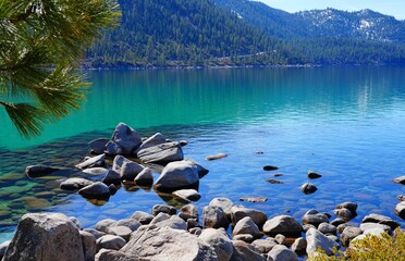 View of rocks and clear blue water in the Lake Tahoe Nevada State Park