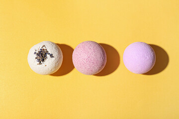 Lavender bath bombs on color background