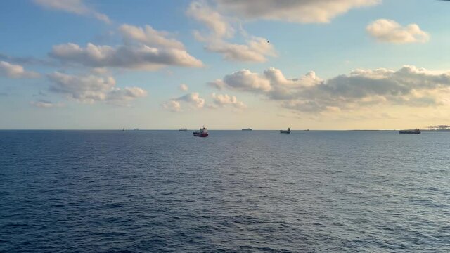Port of Barcelona at sunset Kay line Towers and cranes loading container ships passenger ferry