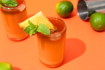 Glasses of tasty mai tai cocktail on color background, closeup