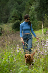 Latin woman in the company of her pet a beautiful golden dog