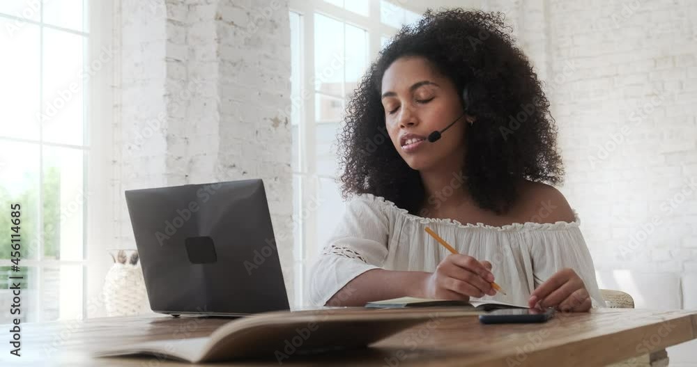Poster young black woman studying online using laptop and video call with teacher and learning. mixed race 