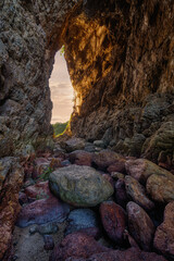cave in the mountains in sunset