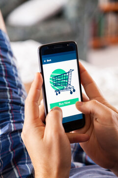 Person relaxing at home doing shopping online with app on phone