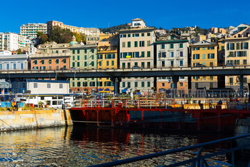 Fototapeta na wymiar Old Port of Genoa with colorful houses on italian coastline outdoor.