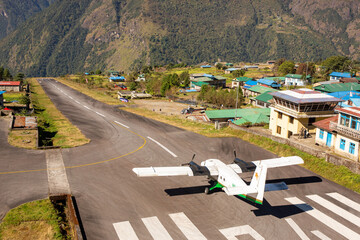 Airplane preparing for take off at Lukla airport, the most dangerous airport in the world.