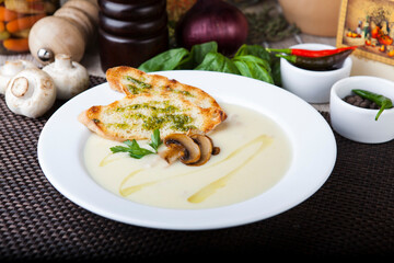 mushroom soup with toast and pesto sauce
