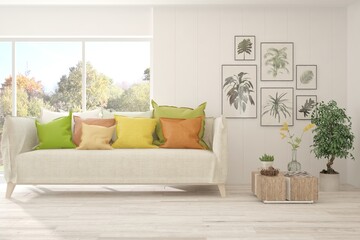 Stylish room in white color with sofa and autumn landscape in window. Scandinavian interior design. 3D illustration