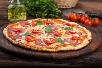 pepperoni pizza with tomatoes and basil
