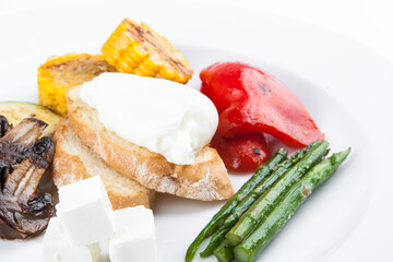 grilled vegetables with asparagus cheese and poached egg
