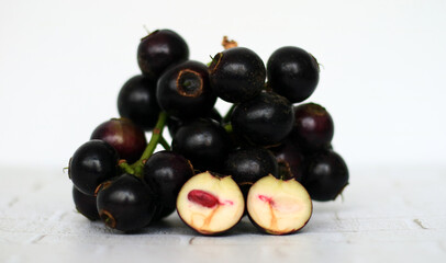 Gowok fruit or Syzygium polycephalum on white background. Commonly known as kupa or kepa in Indonesia. 