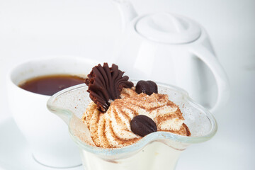 delicious sweet dessert on white plate with tea