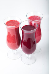 bright berry smoothies on a white background