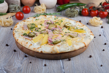 pizza on a wooden light background with decorative design
