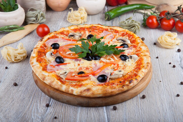 pizza on a wooden light background with decorative design
