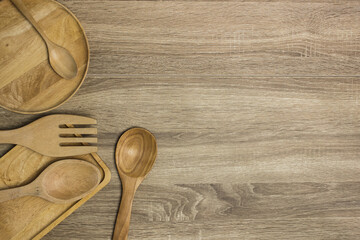 wooden kitchen utensils on a table with copy space. 