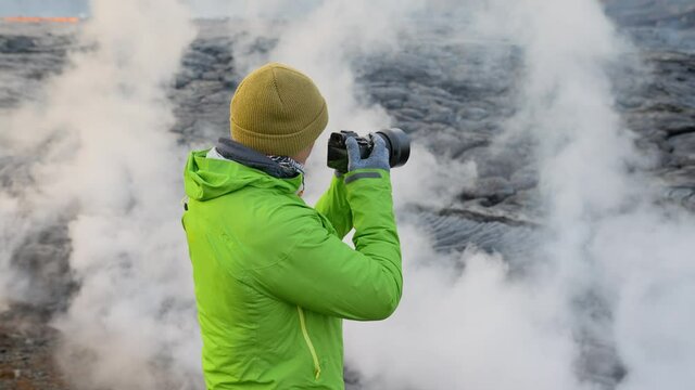 Photographer With Camera By Lava Flow From Erupting Fagradalsfjall Volcano