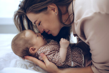 Woman with a baby. Beautiful mother with a baby. High quality photo - 456128230