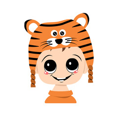 Avatar of a child with big eyes and a wide smile in a tiger hat. Cute kid with a joyful face in a festive costume for new year and Christmas. Head of adorable baby with happy emotions