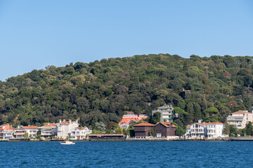 Fototapeta na wymiar Houses on the shore of Istanbul Bosphorus, villas by the sea,