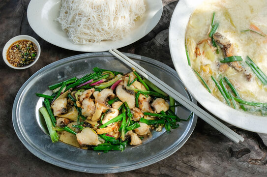 Common Chinese restaurant food. Stir Fried Ginger, Green Onions Fish Slices with Pickled Mustard Vegetable Vermicelli Noodle Soup. Great on a hot sunny afternoon lunch