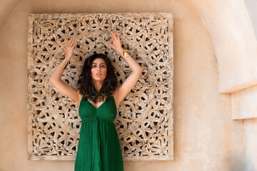 Beautiful girl posing in a middle eastern room interior