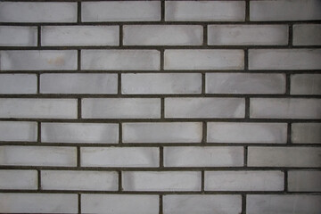 Black and white brickwork. Brick wall with concrete.