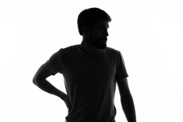 Fototapeta na wymiar man posing in the shadows anonymous studio